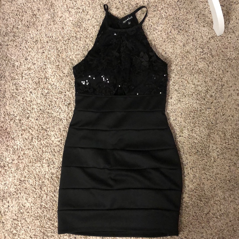 Gorgeous sequined (top) dress w/peek a boo. Halter